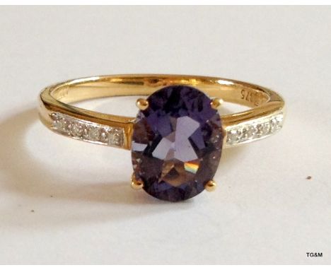 A 9ct gold hallmarked amethyst and diamond ring size Q