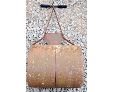 A cast metal garden roller