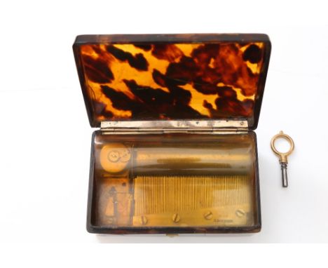 A Tortoiseshell shell with yellow  mounts musical snuff box. Not working (spring) in need of restoration. C1820 Maker M Bordi