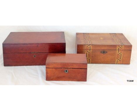 A mahogany tea caddy, a mahogany storage box and an inlaid box