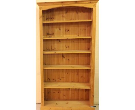 A pine bookcase and dressing table stool. (stool not in picture)