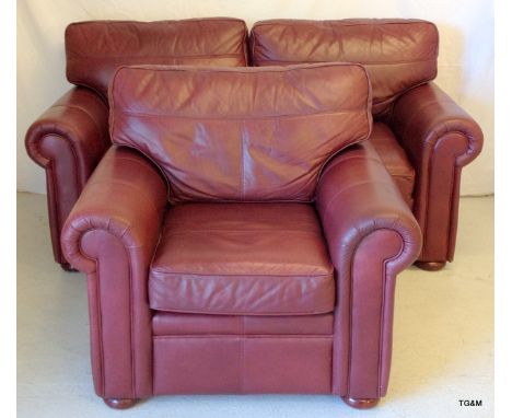 A leather 2 seater sofa bed and matching arm chair