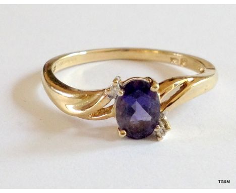 A 9ct gold hallmarked amethyst and diamond ring size R