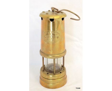 A brass miners lamp by Lamp and Limelight Company - Hockley 22cm high