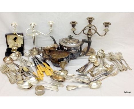 A quantity of silver plate including tea set, flatware and candelabra