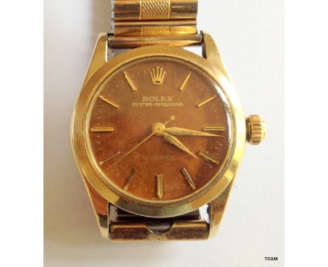 A Rolex Oyster, manual wind. Small size, gold plated case.  3cm face on expanding strap