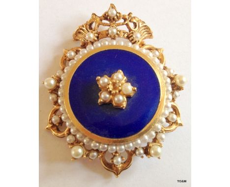 A gilt and enamel pearl brooch