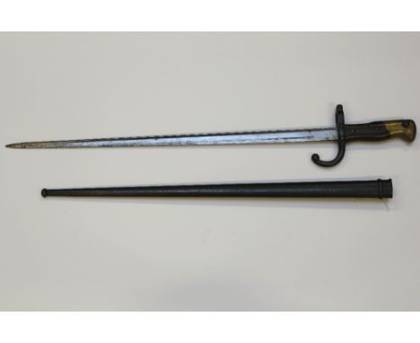 A French model 1874 Gras sword bayonet in scabbard manufactured at the St. Etienne arsenal in 1877