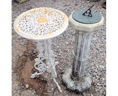 A garden sundial and a cast garden lamp table