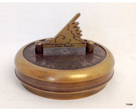 A brass cased compass