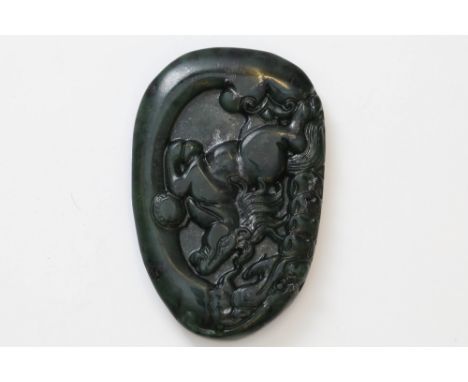 A carved jade pendant