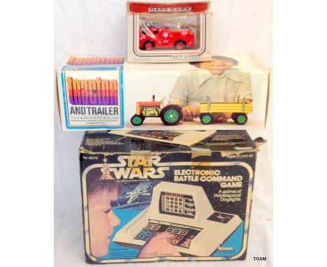 A vintage electronic Star Wars battle command game, a clockwork tin plate tractor and collectors car