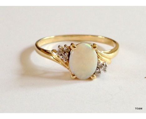 A 9ct gold hallmarked opal and diamond ring size Q
