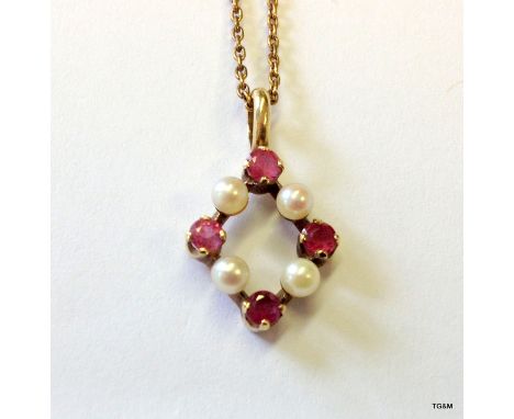 A 9ct gold pink sapphire and pearl pendant