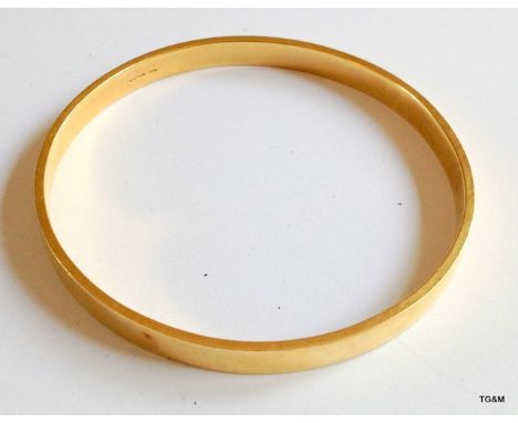 An 18ct gold ladies bangle