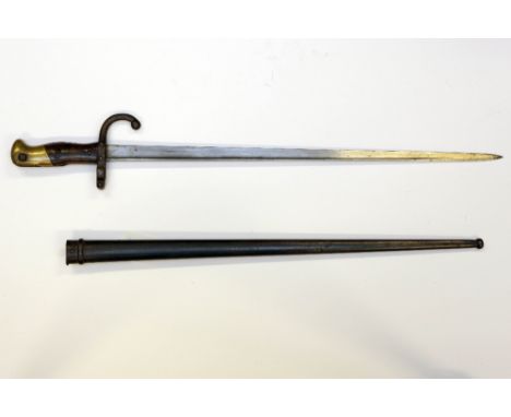 A French model 1874 Gras sword bayonet in scabbard manufactured at the St. Etienne arsenal in 1876