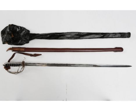 George V period sword in leather scabbard with wax fabric travel bag