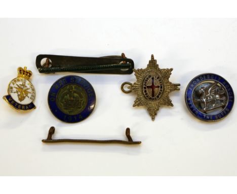 An officers silver and enamel Coldstream Guards badge with 2 WW1 wound stripes a 1914 On War Service badge a numbered The Buf