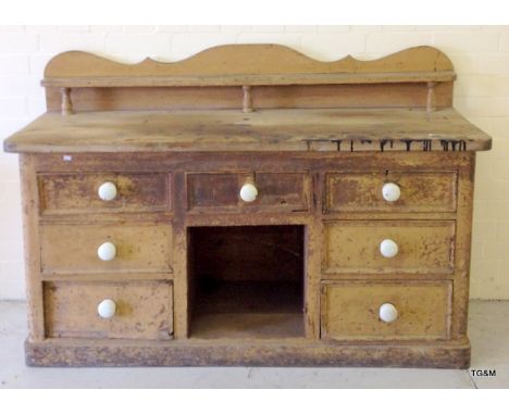 A Victorian Pine Dresser Base with white ceramic handles 
