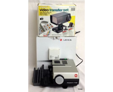 A Leica Pradovit P150 slide projector in original box with a Kaiser video transfer unit 