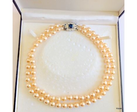 A boxed pearl double string choker