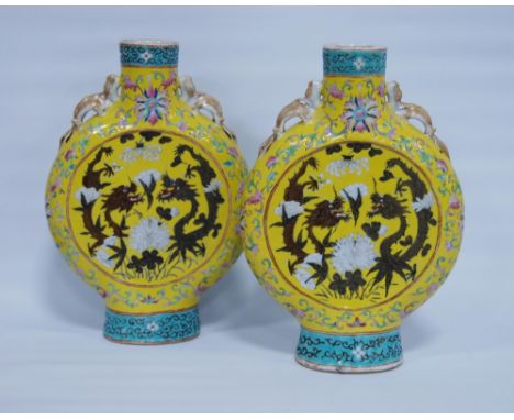 Pair of Chinese famille rose moon flasks, probably late Qing/Republic period, the central panel with a pair of brown glazed d