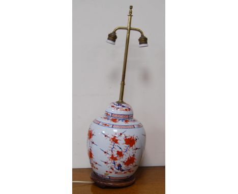 Oriental Imari oviform vase/lamp in the 18th century style with all over floral panels, converted to electricity, on a fixed 