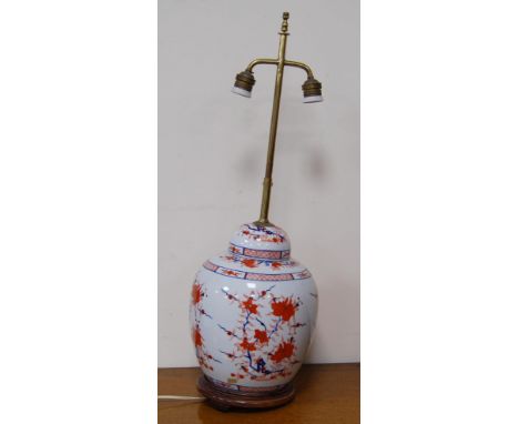 Oriental Imari oviform vase/lamp in the 18th century style with all over floral panels, converted to electricity, on a fixed 