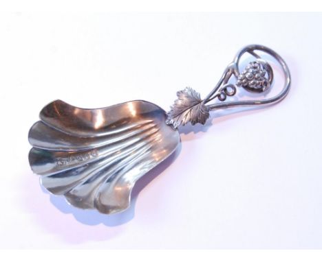Silver scallop caddy spoon with fruiting vine grip, by Hilliard and Thomason, Birmingham 1855. 