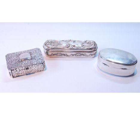 Early 20th century silver hairpin box by Birks, another, hammered silver, and an oval silver box with gilt interior, Birmingh