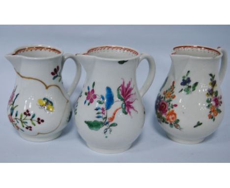 Three 18th century first period Worcester sparrow beak cream jugs, decorated with polychrome enamel floral sprays, 8.5cm and 