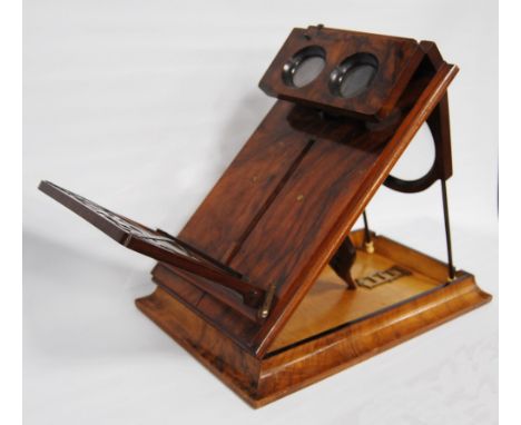 Victorian burr walnut stereoscopic table viewer, the table tilting on a ratcheted bracket with pierced card holder, 33cm high