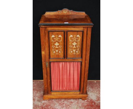 Rosewood inlaid music cabinet, c. early 20th century, the door with two matching panels of inlaid ivory and satinwood mythica