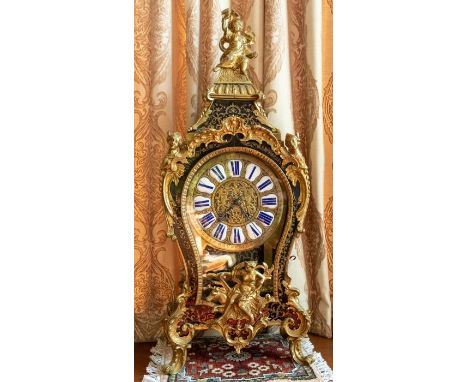 A Victorian French boulle clock on a bracket. Inlaid with tortoiseshell and elaborate brass work. With two-train sprung movem