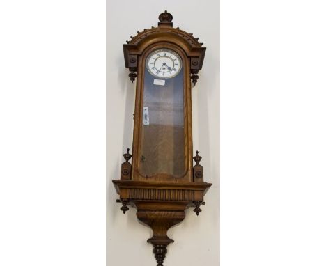 A good Vienna wall clock of small proportions retailed by Perrat of Weston Super Mare. Single train weight driven movement. T