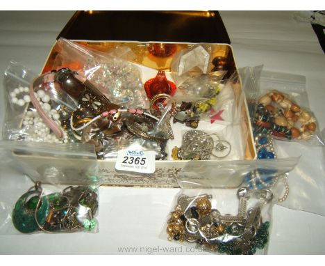 A tin of mixed Costume jewellery including 22 necklaces, bracelets including Mother of Pearl, watch etc.