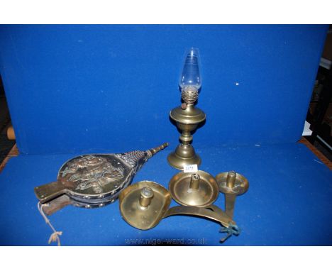 **Three 17th century dutch brass Candle Holders of various sizes, small brass Oil Lamp and pair of brass and leather Bellows.