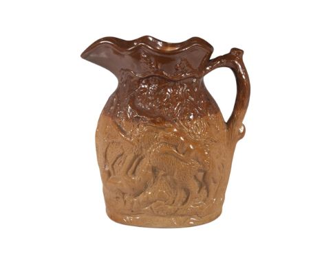 A large salt-glaze stoneware jug depicting hunting dogs capturing their prey in raised relief, with a tree branch handle. Dou