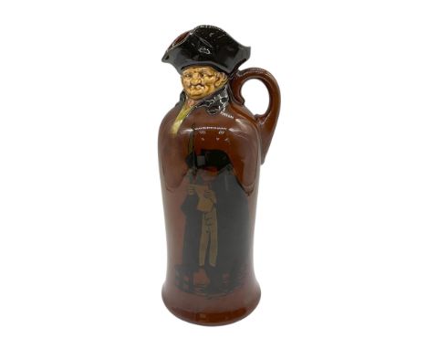 The Kingsware dark glaze Watchman flask features loop handles and is shaped like a cloaked gentleman wearing a tricorn hat. T
