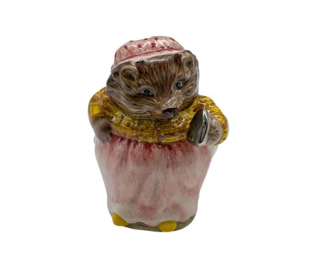 Mrs. Tiggy-Winkle. Hand decorated porcelain figure of Mrs. Tiggy-Winkle, a hedgehog laundress from Beatrix Potter's 1905 chil