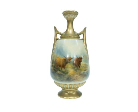 A vase with elegant gold colored handles, mouth, and base shows a stunning scene of two bulls standing majestically in a pict