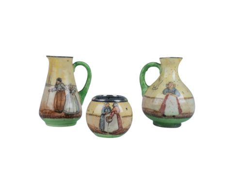 A bowl with hallmarked sterling silver rim and two yellow pitchers showcase artwork of village people enjoying their daily li