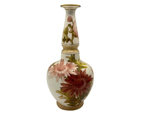 A salt-glaze Carrara Ware bottle vase, numbered K.203.9, with hand-painted production marks. It features a slender gilded nec