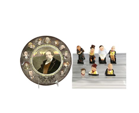 This charming set of eight Royal Doulton pieces celebrates the work of Charles Dickens, featuring four figurines of Fagin, Fa