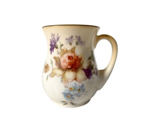 A cream colored pitcher with a gold colored rim that features flower bouquets painted on both sides. Royal Doulton backstamp.