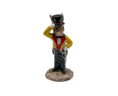 Hand decorated porcelain bunny figure dressed as a circus director. The Bunnykin is shown in a yellow and red jacket with red
