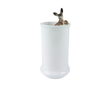 A tall round white vase displays an adorable kangaroo hanging from its rim. Royal Worcester backstamp. Marked 2510. Dimension