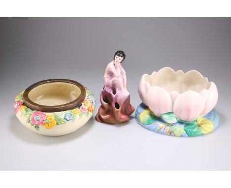 TWO CLARICE CLIFF PLANTERS / BOWLS AND A FIGURAL FLOWER BLOCK comprising A WATER LILY PLANTER, shaped 973, 12cm by 22cm; A FL