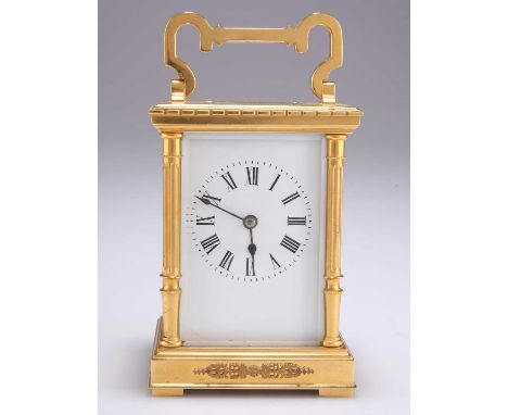 A FRENCH BRASS CARRIAGE CLOCK c.1900, with columnar corners and hinged carrying handle, white enamel dial with Roman numerals