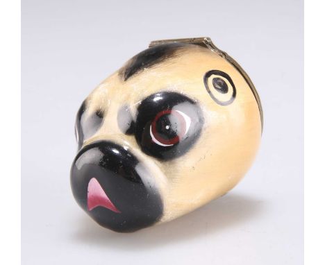 A BILSTON ENAMEL 'PUG' BONBONNIÈRE c.1780, the head with a floral decorated hinged cover. 4.7cm wide